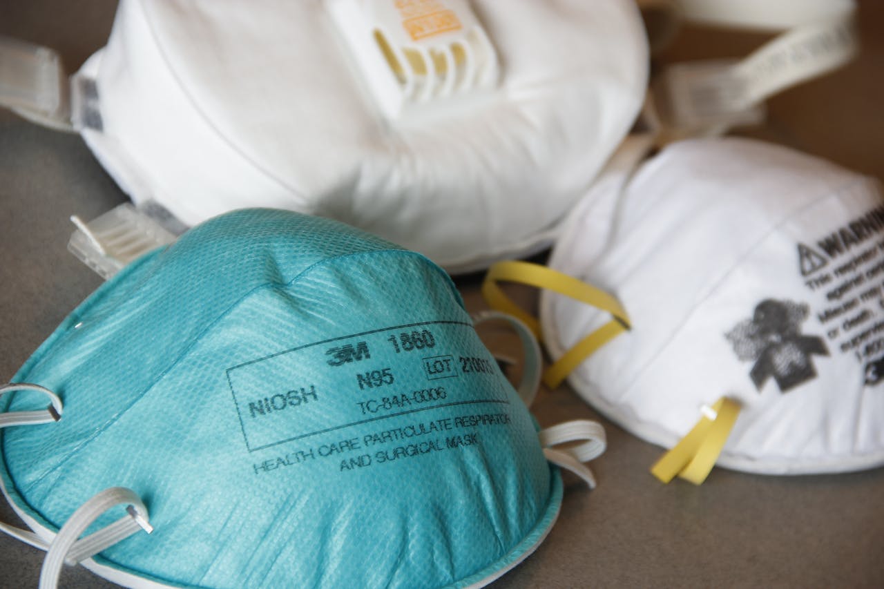 creative Detailed close-up of various N95 masks for healthcare and protection, highlighting design and material.